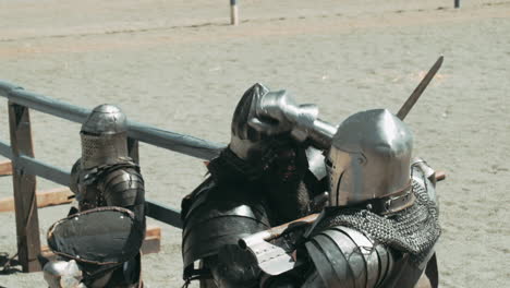 Knight-getting-battleaxe-or-hatchet-in-face