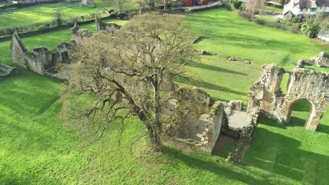 Basingwerk-abbey-landmark-medieval-abandoned-Welsh-ruins-Aerial-view-overlooking-historic-site
