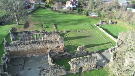 Basingwerk-abbey-landmark-medieval-abandoned-Welsh-ruins-Aerial-view-rising-left-birdseye