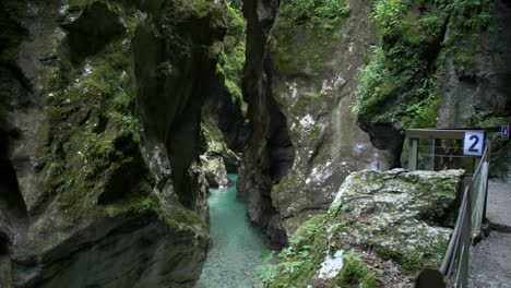 wide-dolly-shot-of-narrow-Tolmin-gorge-canyon-with-beautiful-turquoise-river