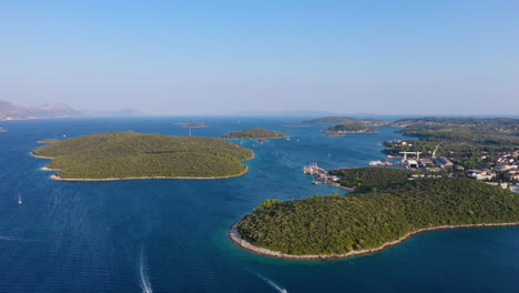 Boats-and-shipping-port-on-Korčula-island,-Dalmatian-coast-Croatia,-aerial-view