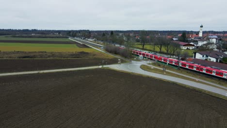 Aerial-view-of-a-train-passing-through-the-Bavarian-countryside