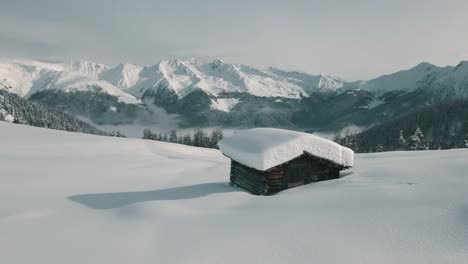 Wooden-hut-with-some-fresh-snow-on-the-roof