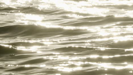 ocean-water-waves-with-reflected-sunlight-in-slow-motion