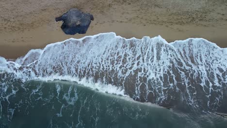 Aerial-Top-Down-View-Of-Tropical-Beach,-Foamy-Ocean-Waves-Washing-Sand