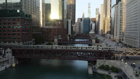 Birds-Eye-View-of-Subway-Train-Crossing-River-in-Downtown-Chicago