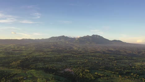 Aerial-view-of-a-landscape-in-Negros-Oriental,-Philippines,-with-mountains-and-clouds