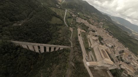 Fpv-high-speed-drone-over-Albornoz-fortress-and-through-Ponte-delle-Torri-arches