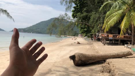 Hand-Showing-Beautiful-Scenery-Of-Sairee-Beach-In-Koh-Tao,-Thailand-On-A-Sunny-Afternoon---POV,-handheld-shot