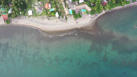 Coral-Reef-Under-Clear-Blue-Sea---Empty-Tropical-Beach-In-Negros-Oriental,-Philippines---top-down-drone