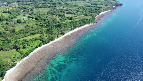 Vista-Aérea-De-Una-Playa-Con-Mar-Turquesa-En-Negros-Orientales,-Filipinas,-Paraíso-Para-Las-Vacaciones-Durante-Un-Día-Soleado