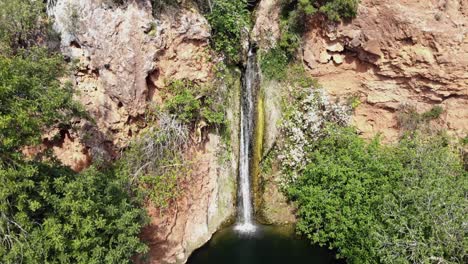 Vigario-falls,-aerial-view-of-the-beautiful-waterfalls-in-Alte,-Algarve,-Portugal