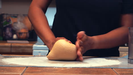 Hands-seen-kneading-fresh-dough-to-make-homemade,-whole-grain-pasta