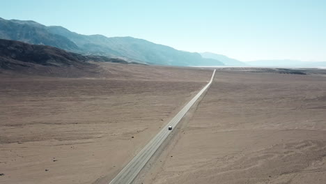 Car-Driving-On-Highway-In-Death-Valley-National-Park-In-California,-USA