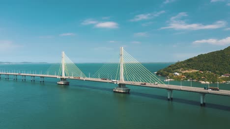 Bridge-above-the-ocean-on-tropical-country-aerial-view,-located-in-Laguna,-Santa-Catarina,-Brazil