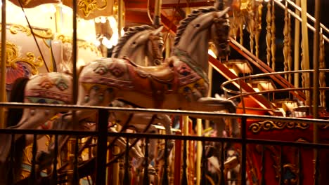 Carousel-roundabout-or-merry-go-round-with-children-having-fun-at-festive-night