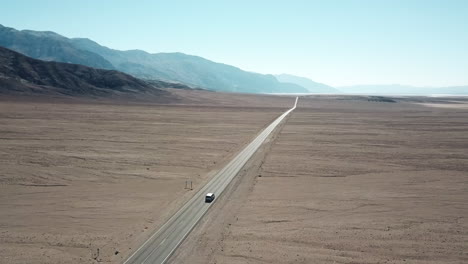 Tracking-Aerial-Shot-Of-A-Car-Driving-In-Death-Valley-National-Park,-Beautiful-travel-Destination