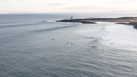 Popular-surf-spot-near-Þorlákshöfn-in-cold-Atlantic-Ocean-water,-aerial