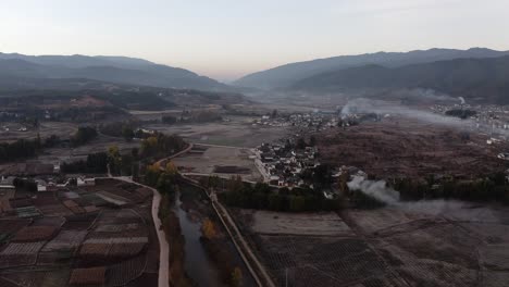 Rural-farming-village-in-China-countryside,-autumnal-sunrise-aerial-view