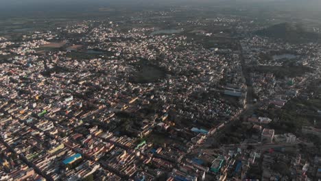 Aerial-flyover-beautiful-city-of-Tiruvannamalai-during-sunlight-in-nature,India