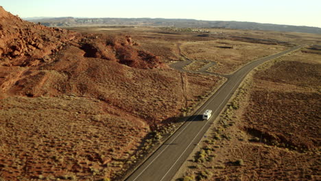 RV-driving-along-road-on-American-road-trip-with-beautiful-smooth-drone-footage