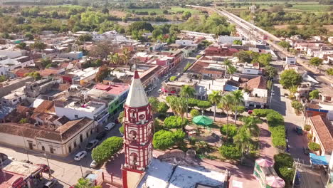Aerial-of-church-tower-overlooking-beautiful-city-in-Mexico-in-summer