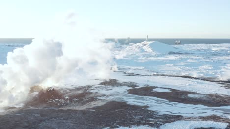 White-gas-from-Gunnuhver-geyser-with-distant-Reykjanesviti-Lighthouse