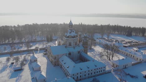 Aerial-view-of-the-Pazaislis-monastery-and-the-Church-of-the-Visitation-in-Kaunas,-Lithuania-at-winter,-snowy-landscape,-the-largest-monastery-complex,-Italian-Baroque-architecture,-around