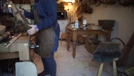 A-craftsman-shaping-a-traditional-welsh-basket-in-the-workshop