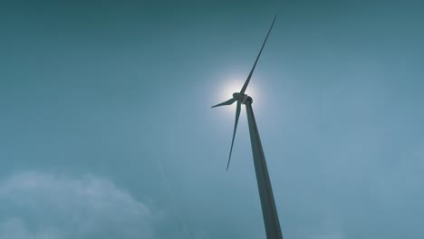 Wind-turbine-generator-shot-on-a-sunny-day-against-the-sun,-located-in-Santa-Catarina,-Brazil