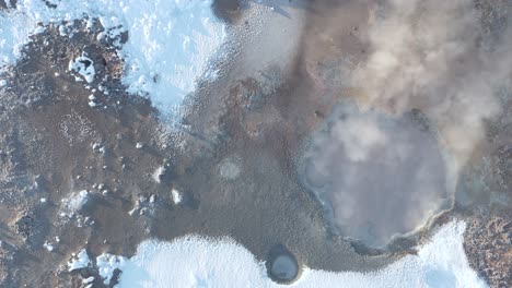 Above-active-mud-pool-emitting-steam,-unique-Icelandic-mudpot,-Gunnuhver