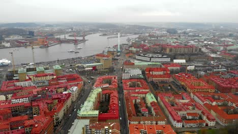 Gothenburg-City's-Typical-Red-Roofed-Buildings-and-Gota-River-AERIAL