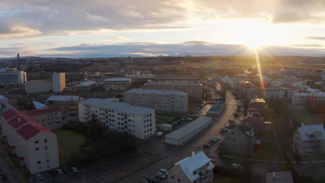Aerial-Sunrise-View-Over-The-City-Of-Reykjavik,-Capital-Of-Iceland---drone-shot