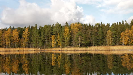 Autumn-Colors-at-Calm-Lake-with-Water-Reflection,-Slider