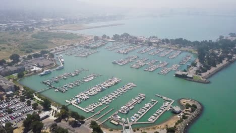 Yacht-aerial-drone-view-Top-view-of-Boats-docked-at-harbor,-marina-pier