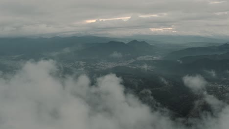 Drone-aerial-view-of-beautiful-landscape-with-mountains-and-volcanoes-in-Guatemala