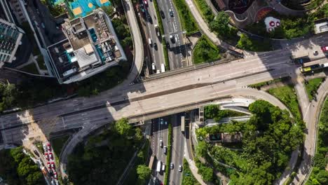 Aerial-birsdseye-view-timelapse-over-speeding-Kowloon-moving-city-highway-traffic-Hong-Kong