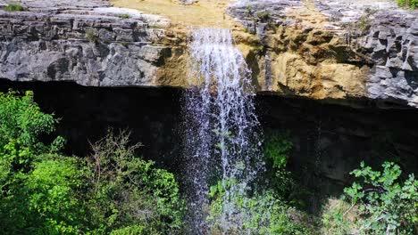 Backward-drone-shot-of-Pericnik-waterfall-in-national-park-Triglav-in-Slovenia