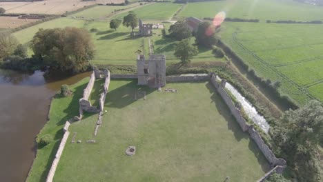 Aerial-Drone-Footage-of-the-ruins-of-Baconsthorpe-Old-Manor,-North-Norfolk