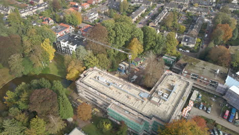 Aerial-overview-of-construction-site-with-a-large-crane