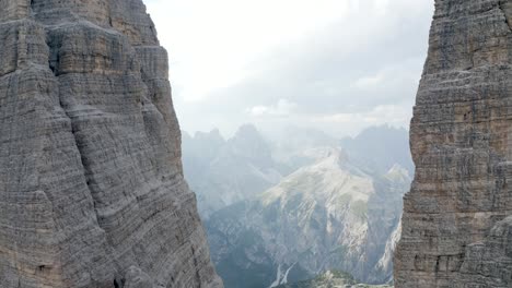 Closeup-Aerial-of-flying-in-between-2-cliffs-in-the-mountains,-Tre-cime-die-Lavaredo,-Dolomiti,-Italia