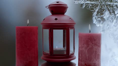 Christmas-decorations-with-red-christmas-lamp-and-burning-candles