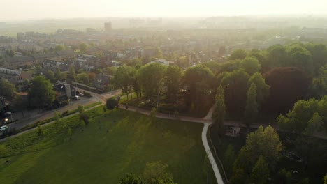 Suburban-Rotterdam-park-greenery-aerial-descending-view-overlooking-residential-neighbourhood