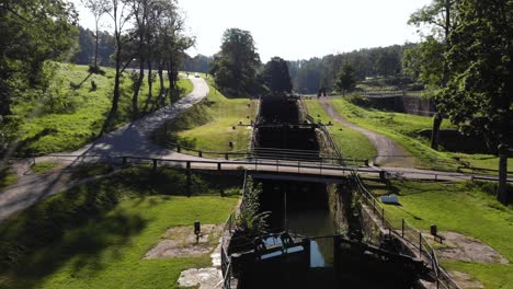 Aerial-flying-over-Gamle-Dal-a-Staircase-Lock-in-Trollhattan,-Sweden