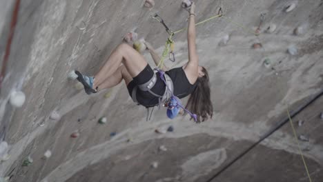 Woman-losing-rock-climb-grip-at-La-Foixarda-recreational-center-Barcelona