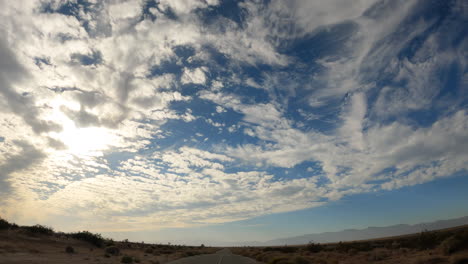 Wide-angle-view-of-the-sky-above-the-Mojave-Desert-landscape-during-a-scenic-drive