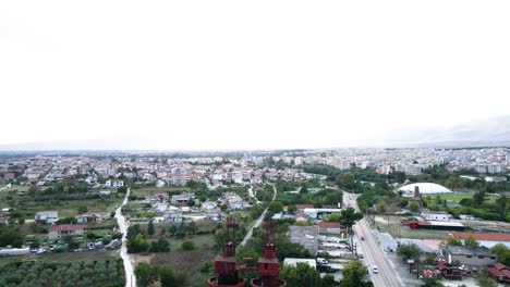 Aerial-drone-4k-clip-moving-forward-next-to-a-chimney-and-an-industrial-area-in-the-area-of-Drama-in-Northern-Greece