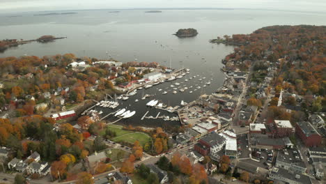 Aerial-view-of-coastal-town-harbor-on-Penobscot-Bay,-Camden-Maine