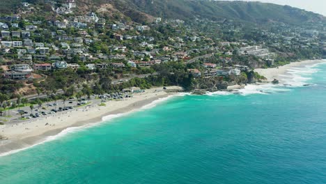 Backwards-Aerial-view-of-Aliso-Beach-park-in-Orange-County-California