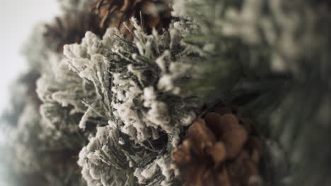Slow-motion-of-Christmas-Advent-wreath-crown-with-pine-cones---shallow-focus-close-up